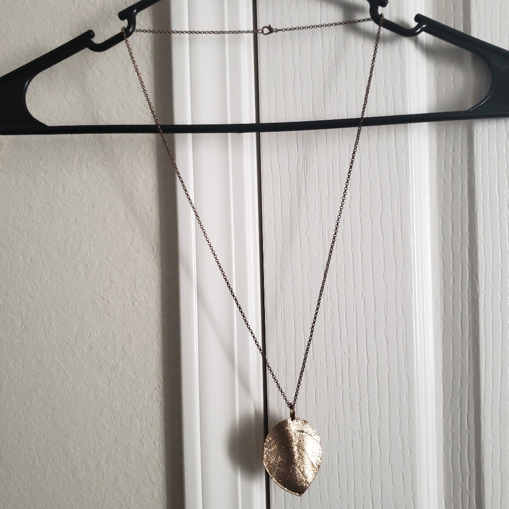 Gold leaf pendant necklace.